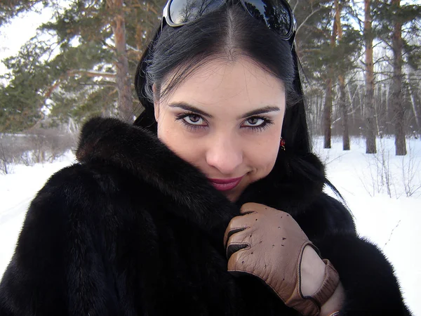The girl in a fur coa — Stock Photo, Image