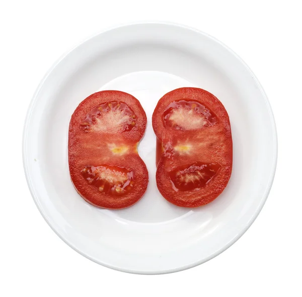 Slice of tomato on plate — Stock Photo, Image