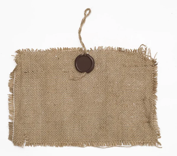 Selo de cera em material de pano de saco — Fotografia de Stock