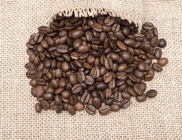 Open sack and coffee beans — Stock Photo, Image