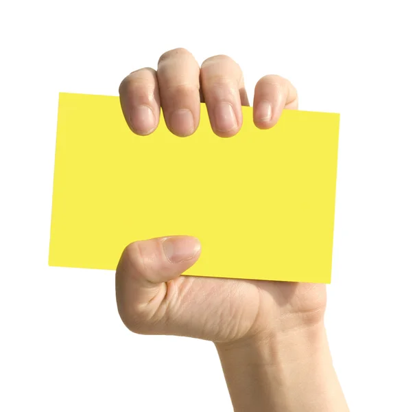 Žlutá karta v ruce žena — Stock fotografie