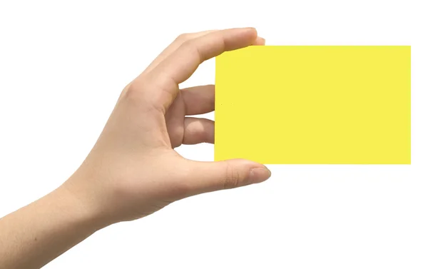 Желтая карточка в руке — стоковое фото