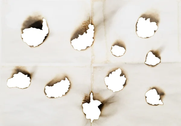 Holes in a paper — Stock Photo, Image