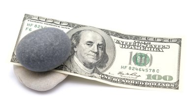 One hundred dollars and pebbe stones clipart