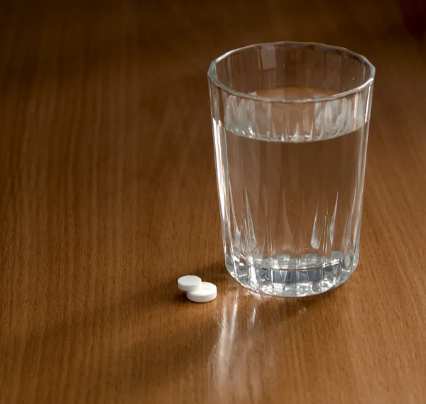 stock image Glass and pills