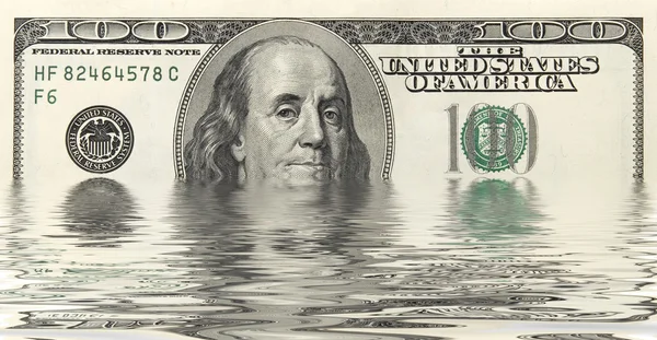 Dólares en agua —  Fotos de Stock