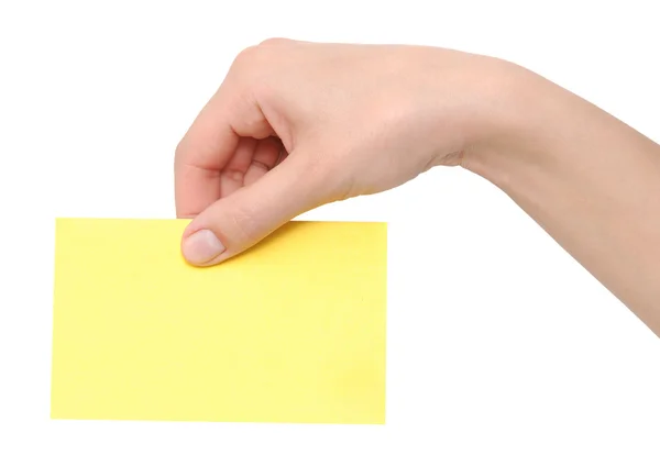 Желтая карточка в руке — стоковое фото