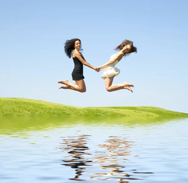 Two jumping woman — Stock Photo, Image