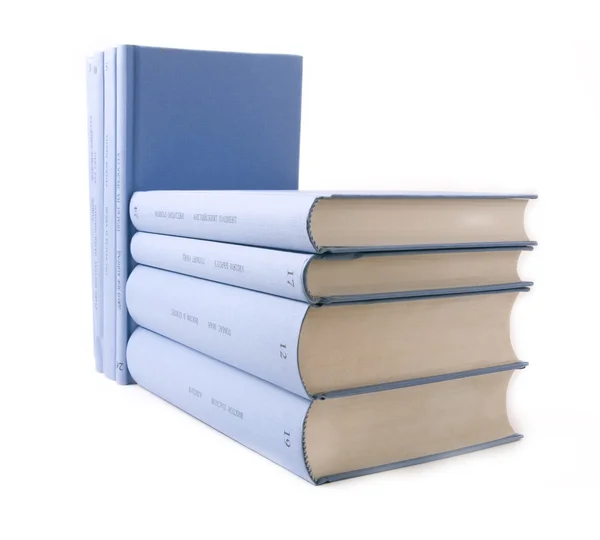 Livros azuis sobre um fundo branco — Fotografia de Stock