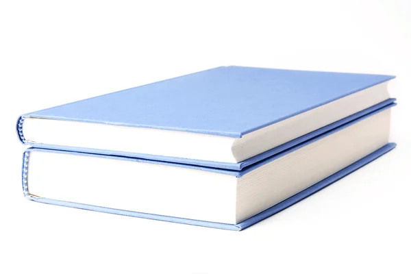 Livros azuis sobre um fundo branco — Fotografia de Stock