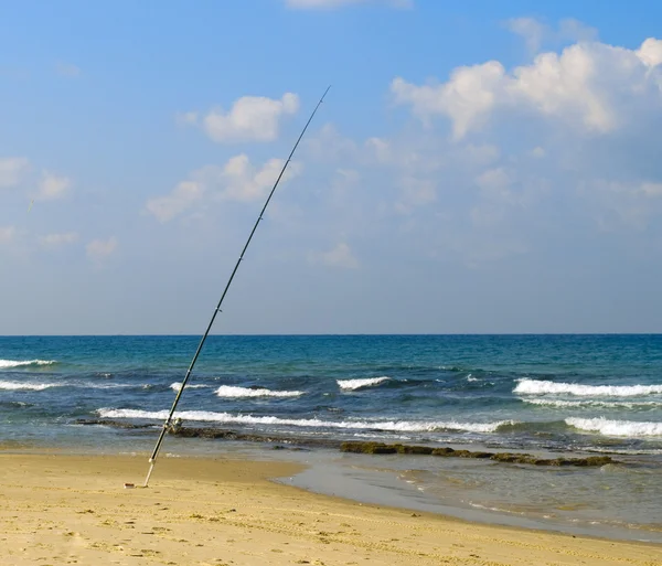 Fishing rod on a beach — Stock Photo, Image
