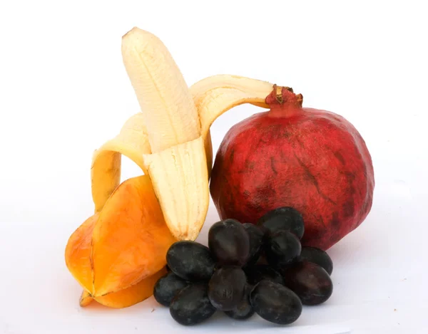 Banana, pomegranate, carambola, grapes — Stock Photo, Image