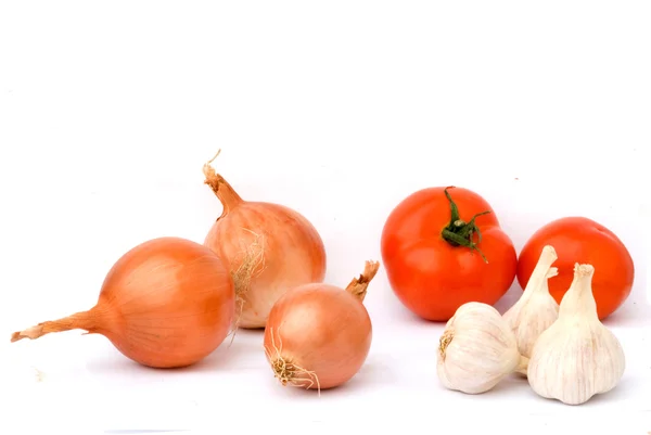 Garlic and onion bulbs and tomatos — Stock Photo, Image