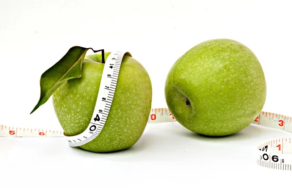 Apples with measuring tape — Stock Photo, Image