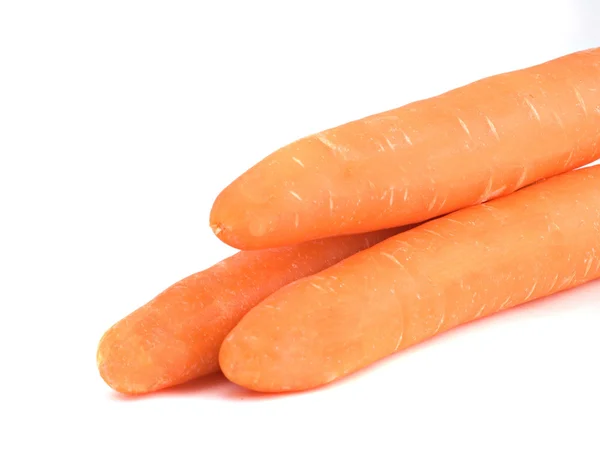 Три морковки на белом фоне — стоковое фото