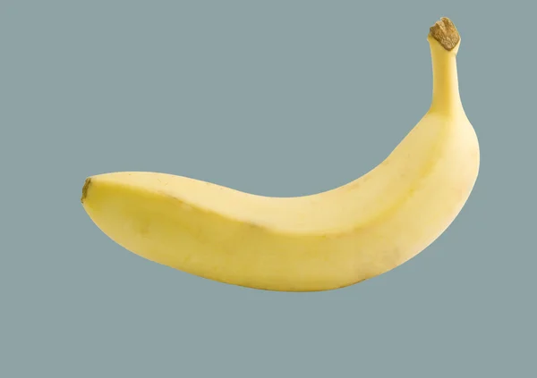 Banana isolada sobre fundo cinzento — Fotografia de Stock