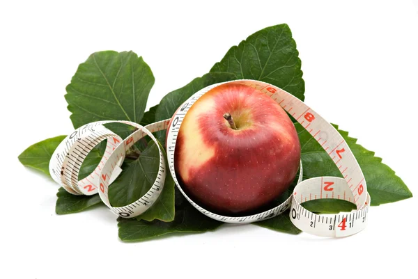 An apple with measuring tape — Stock Photo, Image