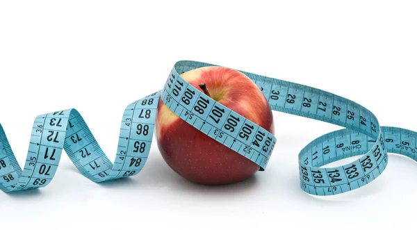 Apple with measuring tape — Stock Photo, Image