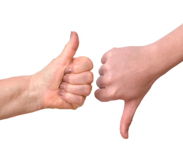 Руки, що показують великий палець вгору і великий палець вниз — стокове фото