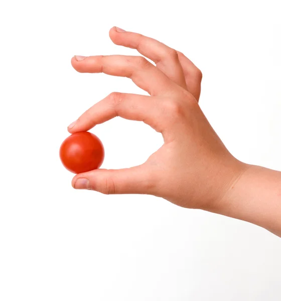 Mano con tomate cherry —  Fotos de Stock