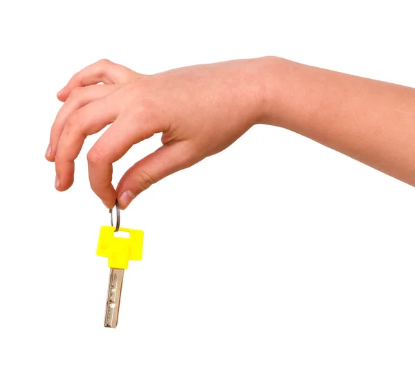 Hand holding key with yellow bow — Stock Photo, Image