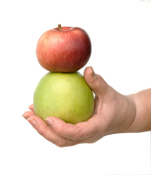 Mão com maçãs verdes e vermelhas — Fotografia de Stock