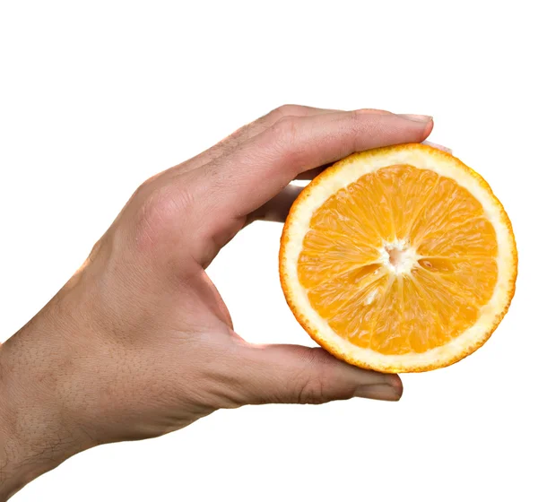 Ruka drží polovinu Orange — Stock fotografie
