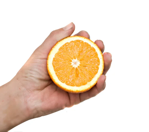 Mão segurando metade de laranja — Fotografia de Stock