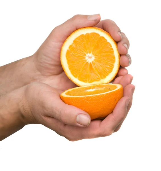 Hand holding halves of orange — Stock Photo, Image