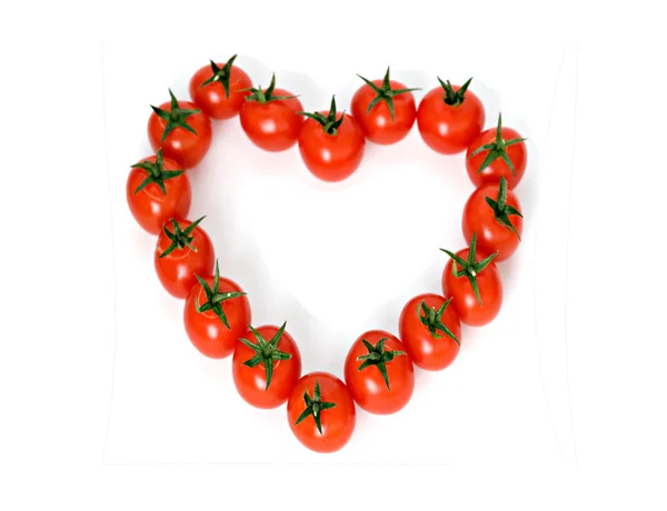 Heart drawn from tomatoes Stock Image
