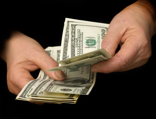 Mãos a contar dólares — Fotografia de Stock