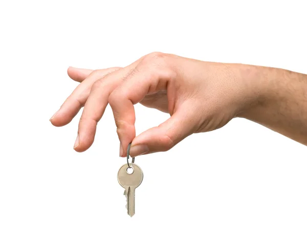 Zbliżenie dłoni trzymając klucz — Zdjęcie stockowe