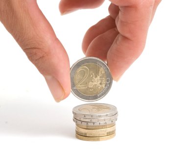 Hand holding two euro coin clipart