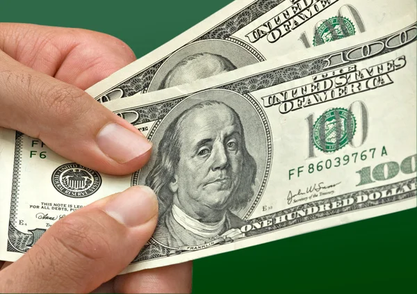 Mãos com notas de dólar — Fotografia de Stock