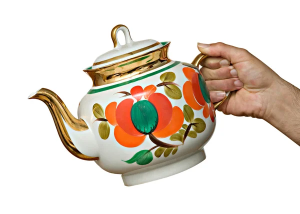 Ceramic teapot in hand — Stock Photo, Image