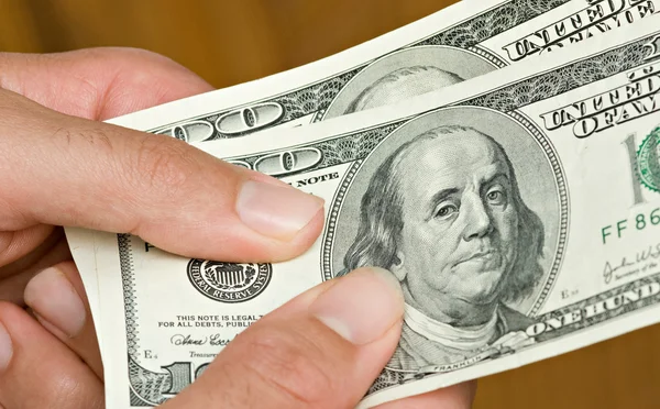 Hands with dollar bills — Stock Photo, Image