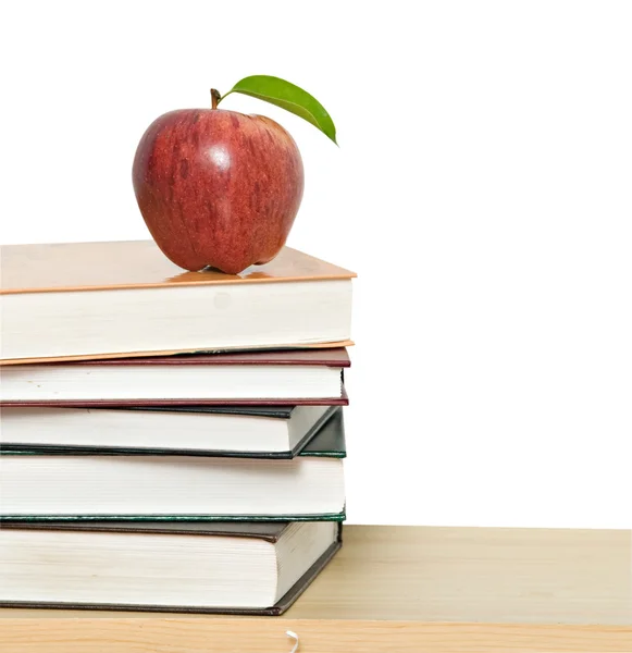 Red apple on pile of books — Stock Photo, Image
