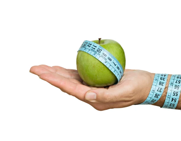 Hand with apple and measuring tape — Stock Photo, Image