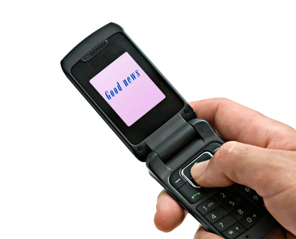 Teléfono móvil con la etiqueta "Buenas noticias" en su solapa — Foto de Stock