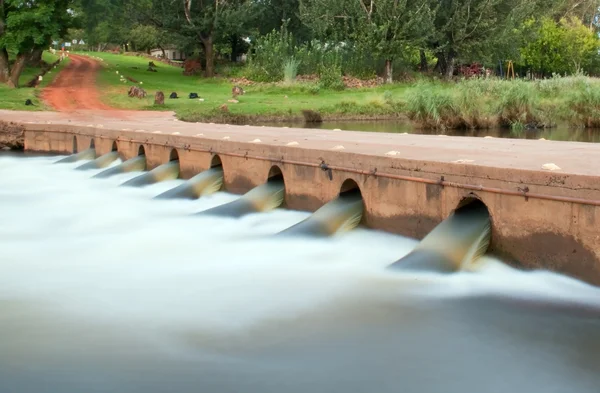 stock image Low bridge with water