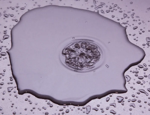 stock image Water drop on shiny surface