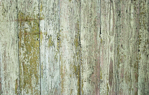 Wooden protection on all background, with traces of a green paint