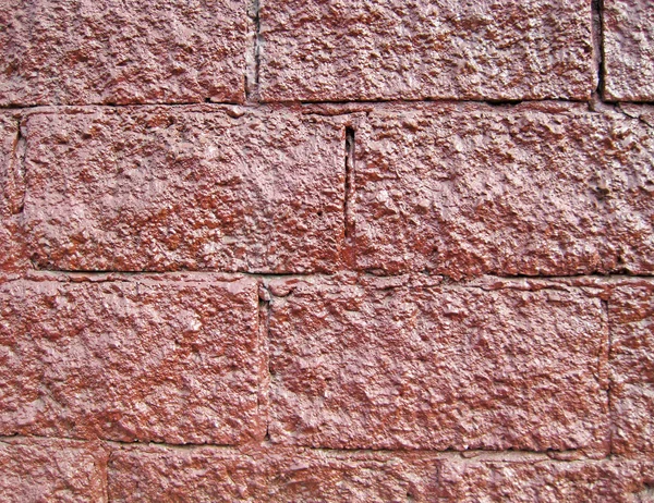 Hintergründe, Wand aus rotem Stein — Stockfoto