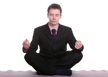 Businessman doing yoga clipart