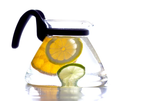 Three citrus in jug — Stock Photo, Image