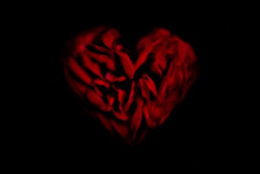 Heart-shaped red blurred rose on black clipart