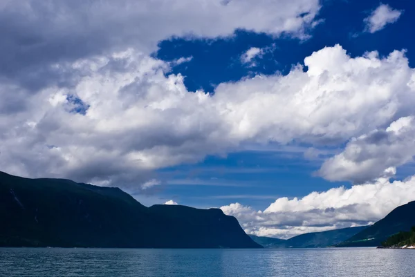 White clouds over Norwegian fjord — Stock Photo, Image