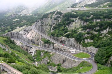 Serpentine road in Alps clipart