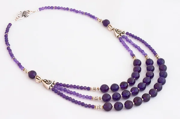 Amethyst necklace over white — Stock Photo, Image