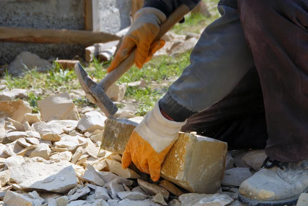 stock image Stone in his hand, cutting